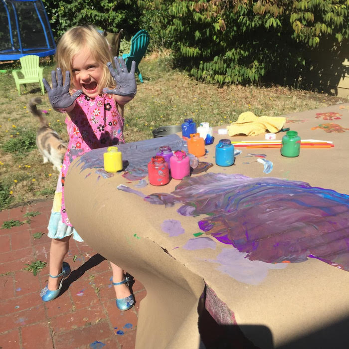Child coloring at a desk inside VIDA Coworking