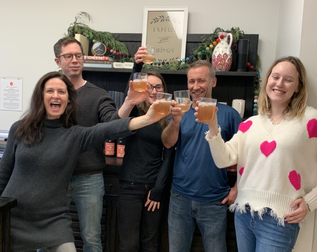 Five people cheersing their drinks