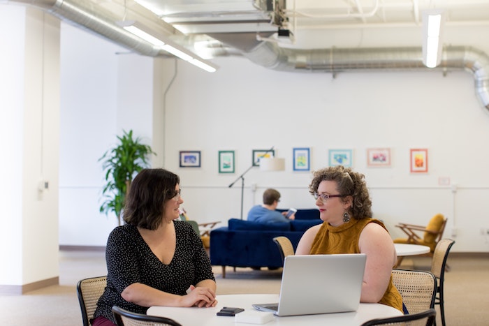 two women working together at vida coworking in portland oregon