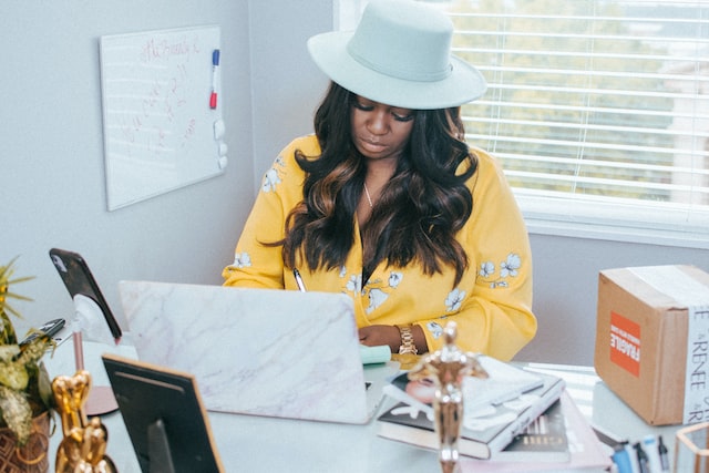 a female small business owner working at a desk in portland oregon