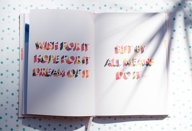 An aesthetic photo of a book laid open on a white table