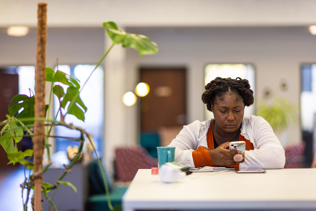 A woman scrolling on her phone
