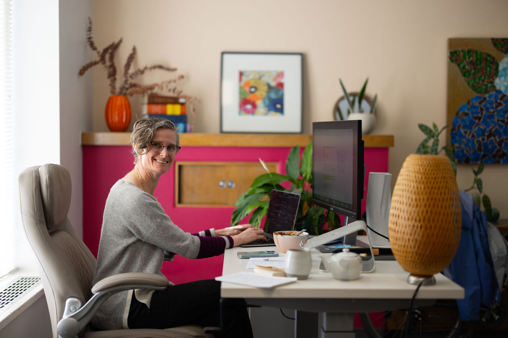 woman business owner at work at vida coworking